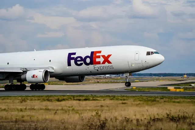 FedEx Express cargo airplane taking off or landing on a runway